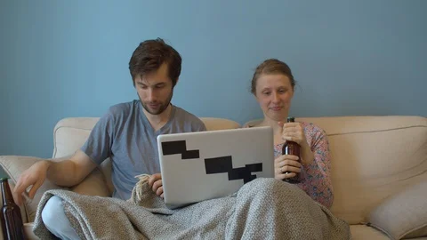 Family drinking beer on the couch Stock Footage 129231856