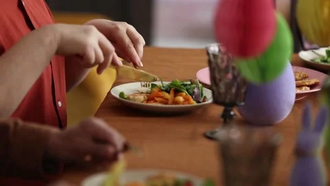 Family is eating at Easter dinner sitting at the table at home Stock Footage 172528752