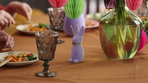 Family is eating at Easter dinner sitting at the table at home Stock Footage 172528755