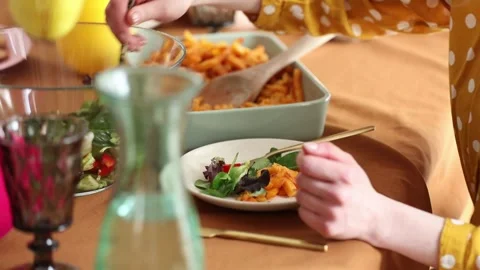 Family is eating at Easter dinner sitting at the table at home Stock Footage 172528757