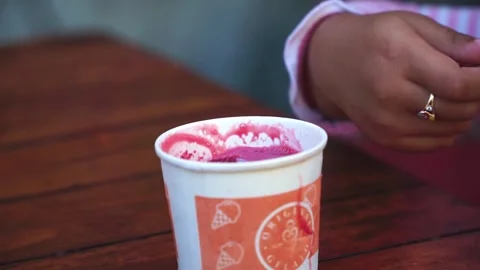 A scoop of pink ice cream in a specializ, Stock Video