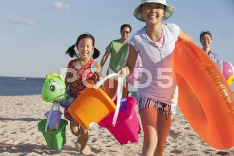 Family enjoying the beach together Stock Photos