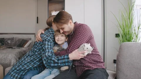 Family enjoys time together while moving into a new home with their son and pets Stock Footage 346229253