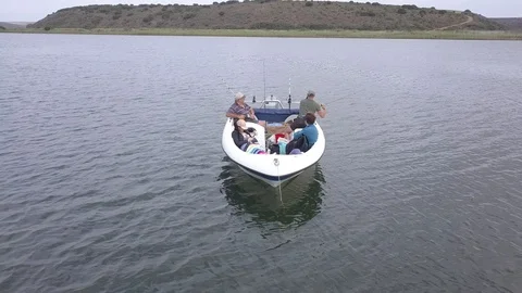 Family fishing on boat Stock Footage