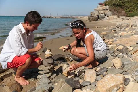 Family fun stacking stones Stock Photos