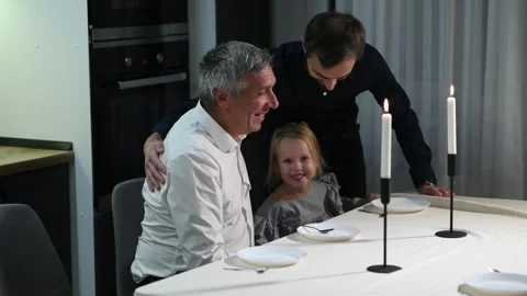 Family gathers around the dining table Stock Footage 340063065