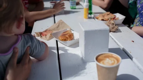 Family having breakfast in the café Stock Footage 94884591