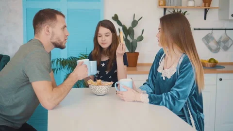 Family Having Breakfast in the Kitchen Stock Footage 105931407