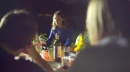 Family Having Dinner In Garden At Night Stock Footage