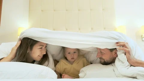 Family having fun in bed 스톡 동영상 119352004