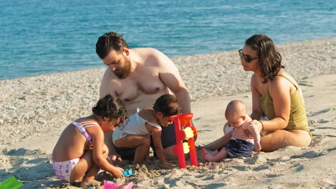 A Family Having Fun With The Sand Stock Footage 280252620
