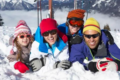 Family Having Fun On Ski Holiday In Mountains Stock Photos