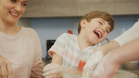 Family having fun while baking together Stock Footage 100000705