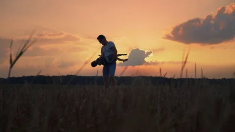 Family having a rest on nature, having fun and hugging at sunset Stock Footage 80341867