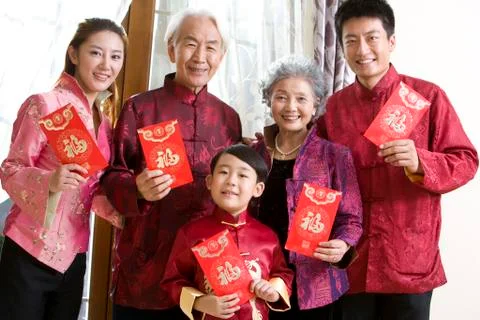 Family holding Chinese red envelope Stock Photos