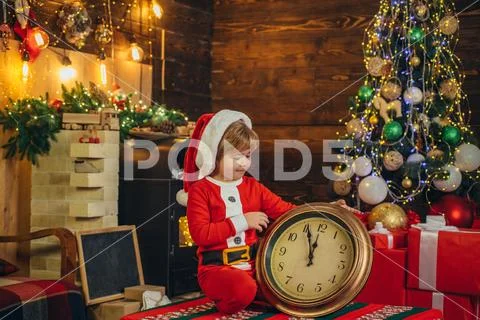 Family holiday. Boy child play near christmas tree. New year countdown. Merry Stock Photos