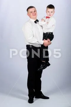 Family holiday. Relations of dad and son. Gentleman upbringing. Father carry hug Stock Photos