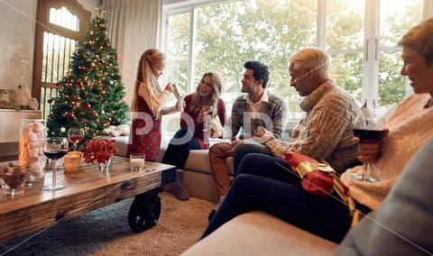 Family at home celebrating christmas together Stock-Fotos