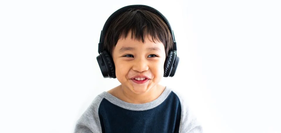 Family, home, technology and music concept. Portrait Young little Asian boy l Stock Photos