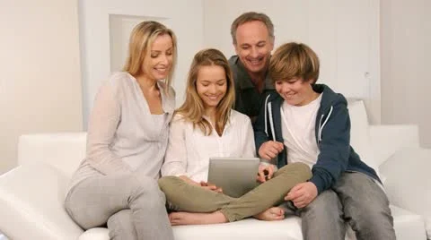 Family at home using electronic tablet Stock Footage 18315414