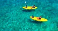 Family Kayaking In Tropical Blue Water, Aerial Drone Stock Footage