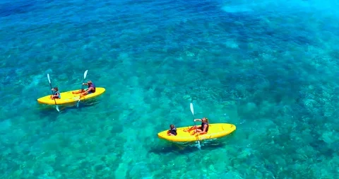 Family Kayaking in Tropical Blue Water, Aerial Drone Stock Footage