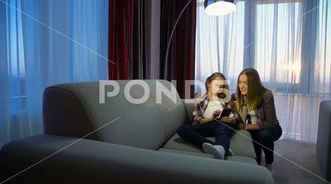 Family leisure communication girl mom home pastime Stock Photos