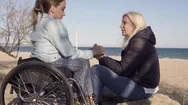 Family Leisure. Young Disabled Handicapped Woman In Wheelchair Speaking With Her Stock Footage