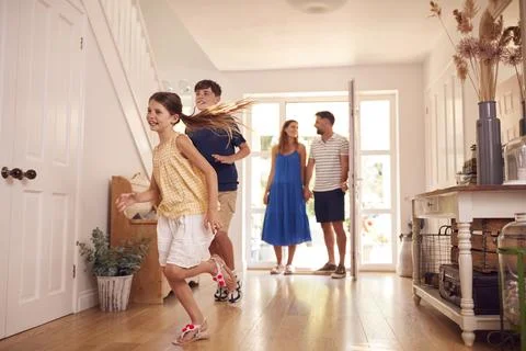 Family Looking Around New Home Before They Move In Stock Photos