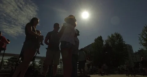 Family looking at solar eclipse with glasses Stock Footage 79117928