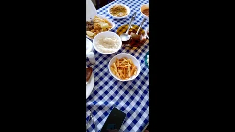 Family Lunch Table Spread with Various Dishes Stock Footage 340928434