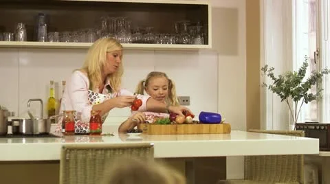 Family making dinner in the kitchen, Stockholm Stock Footage