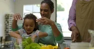 Family Making A Salad. Stock Footage
