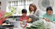 Family Making A Stir Fry Together Stock Footage