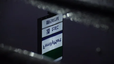 Family Mart Reflection in Puddle Stock Footage 95034049