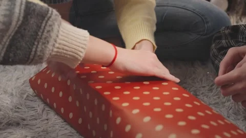 Family members from different generations wrapping Christmas present togeth.. Stock-Footage 345474590