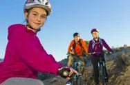 Family mountain biking together Stock Photos