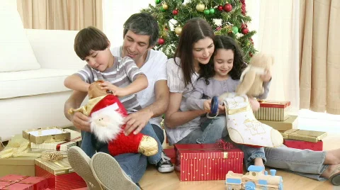 Family opening Christmas presents Stock Footage
