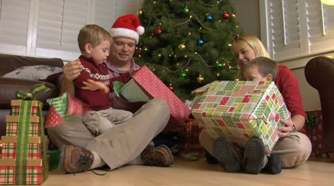 Family opening Christmas presents Stock Footage