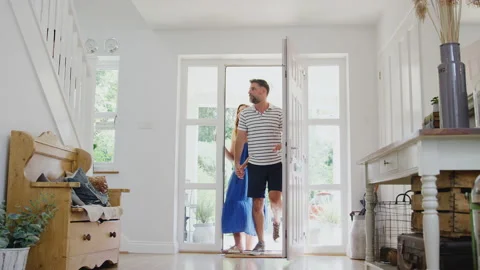 Family Opening Front Door And Looking Around New Home Before They Move In Stock Footage