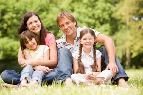 Family outdoors smiling Stock Photos