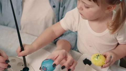 The family is painting Easter eggs. Stock Footage 146811366