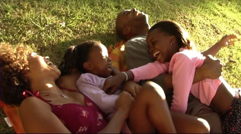 Family in Park hugging Stock Footage