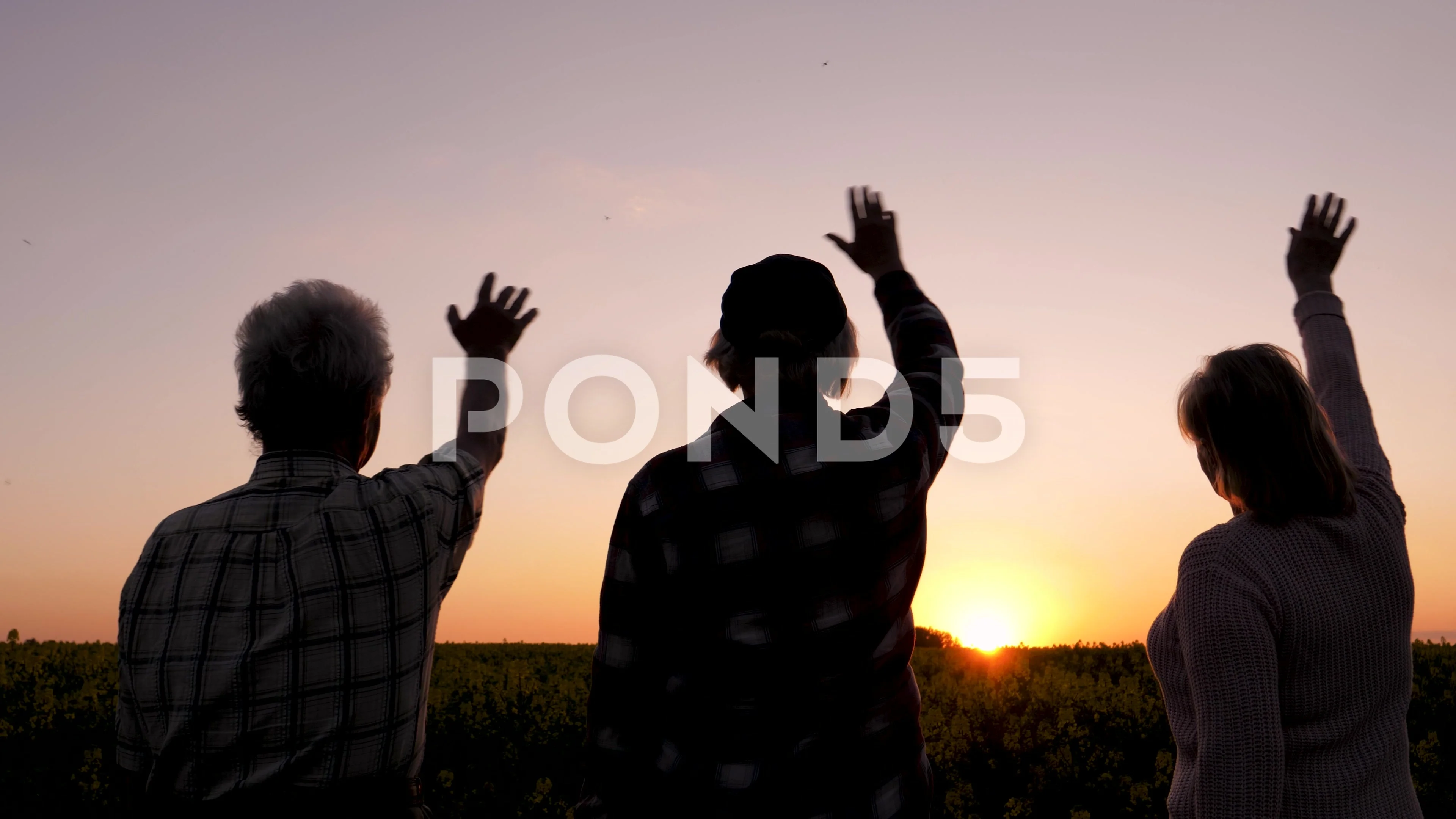 two people waving goodbye