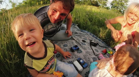 Family on a picnic fun shot - wide angle lenses Stock Footage