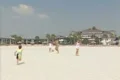 Family playing with ball on beach Footage