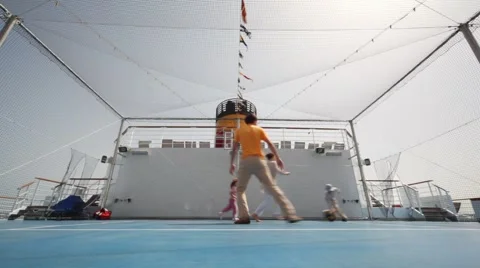 Family playing basketball on cruise ship Stock Footage