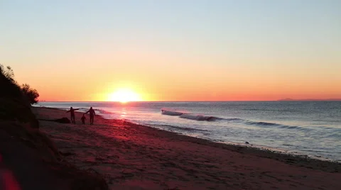 FAMILY PLAYING FLYING ON BEACH AT SUNSET OR SUNRISE; SILHOUETTE Stock Footage 59072224
