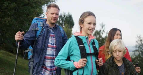 Family Pointing To Their Destination While Hiking Stock Footage 125082786