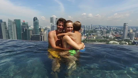 Family in a pool Stock Footage 102126209